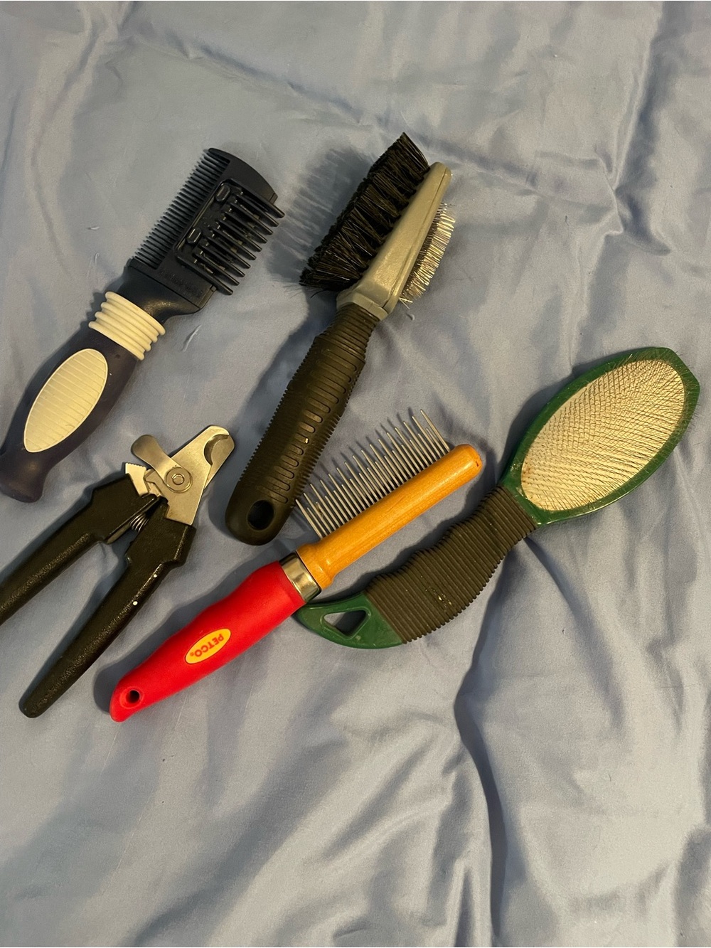 Assorted Pet Grooming Brushes and Clippers